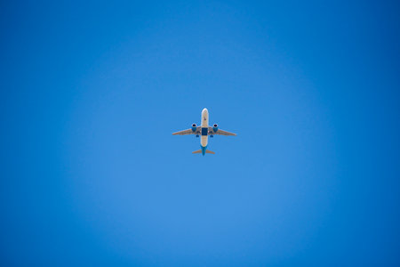 Big white passenger plane in blue skyの写真素材