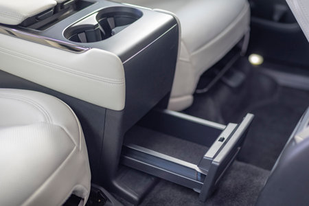 Drawer under car passenger seat