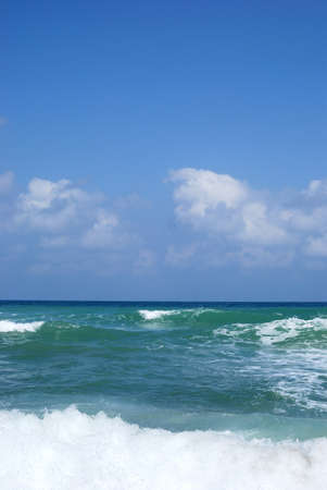 Running waves under the blue sky. Mediterranean sea.の写真素材