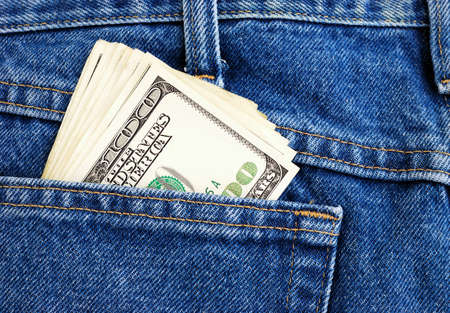 Lot of dollars in a pocket of jeans の写真素材