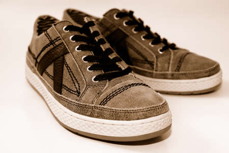 A pair of used comfortable shoes on a white backgroundの写真素材
