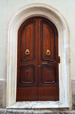 Old arch wooden door close-upの写真素材