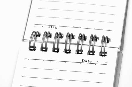 Open notebook on a white background close-up.の写真素材