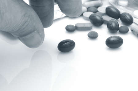 Human hand taking pill close-up.の写真素材