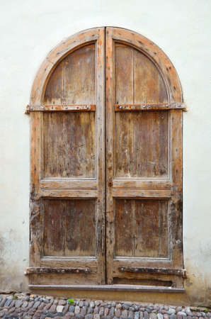 Old arch wooden door close-upの写真素材