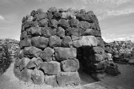 The nuraghe (nuraghi, nuraghes) is ancient megalithic edifice, the symbol of Sardinia and the Nuragic civilization.の写真素材