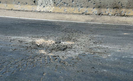 The place where the missile "Grad" fell on the road. Beer Sheva, Israel, 2011.の写真素材