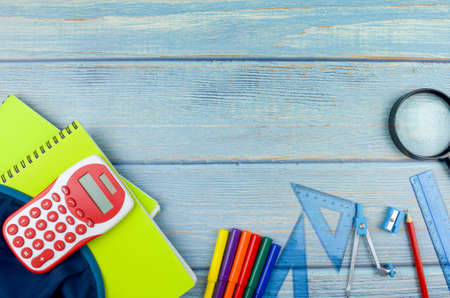 Student backpack and various school supplies, studing, education and back to school concept.