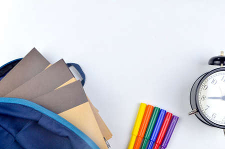 View of flat lay with school backpack and stationery with space for text on white background. Selective focus.の写真素材