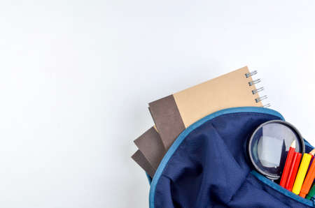 View of flat lay with school backpack and stationery with space for text on white background. Selective focus.の写真素材