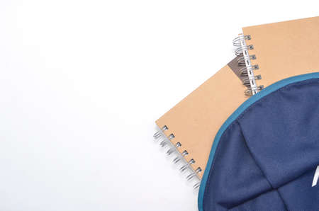 View of flat lay with school backpack and stationery with space for text on white background....