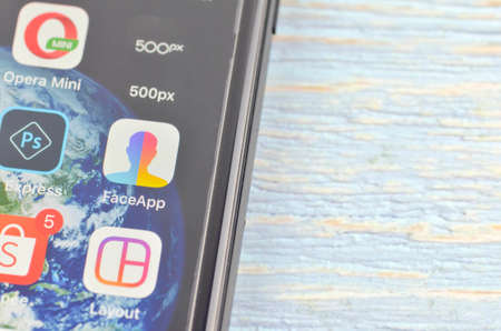 Puchong, Malaysia - July 19, 2019; The iPhone 7 plus with FaceApp on the screen, faceapp is a popular photo editing application on the App Store.のeditorial素材