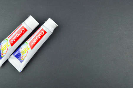 Puchong, Malaysia - July 17, 2019; Colgate toothpaste on black background. Brand of produced by Colgate-Palmolive.のeditorial素材