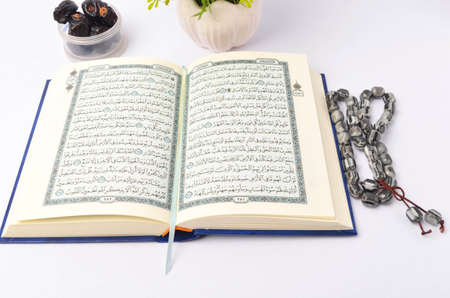 Food Ramadan dry dates or kurma with Quran and rosary. Month fasting culture Muslim and prayer for...