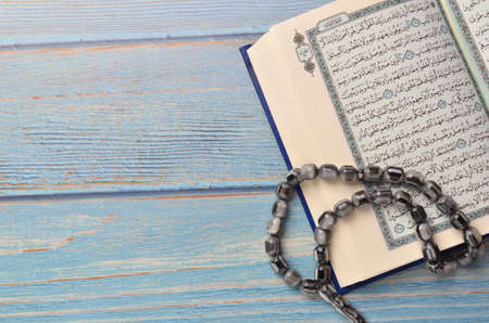 Koran - holy book of Muslims with rosary. Ramadan concept.