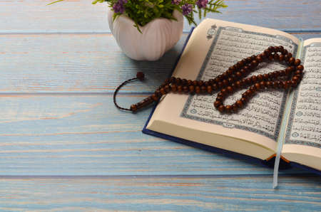 Koran - holy book of Muslims with rosary. Ramadan concept.