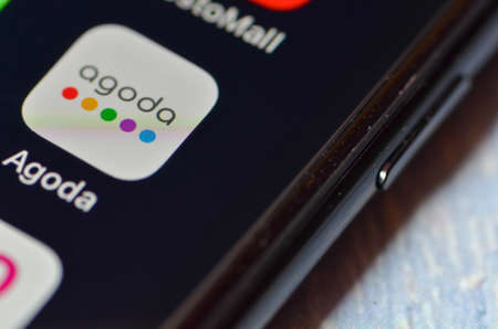 Puchong, Malaysia - July 30, 2019; Close up Agoda App logo on smartphone display.