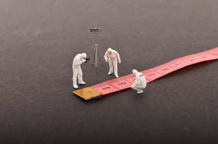 Miniature people ; the figure of a Crime Scene Investigation. Selective focus.の写真素材