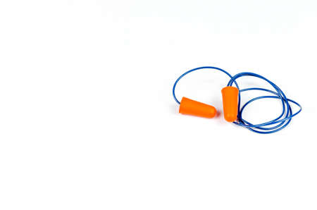 Ear plugs isolated on white background. Orange ear plugs isolated. Selective focus.の写真素材