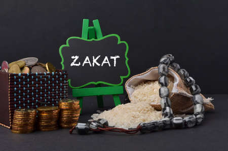 Islamic zakat concept. A contribution structure for Muslims or Moslems to help the poor and needy. Conceptual shoot for property, income and fitrah zakat.の写真素材