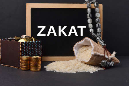 Islamic zakat concept. A contribution structure for Muslims or Moslems to help the poor and needy. Conceptual shoot for property, income and fitrah zakat.の写真素材