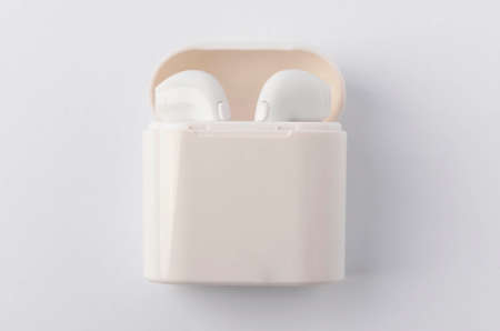 A white wireless headphones on white background. Selective focus.の写真素材