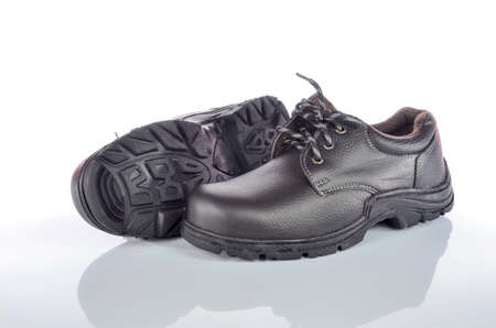 Modern working boots isolated on white background.の写真素材