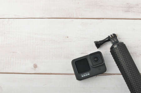 Kuala Lumpur, Malaysia - April 30, 2021: New flagship action camera gopro 9 black on wooden background. Selective focus.のeditorial素材