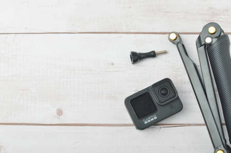 Kuala Lumpur, Malaysia - April 30, 2021: New flagship action camera gopro 9 black on wooden background. Selective focus.のeditorial素材