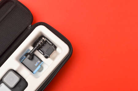 Kuala Lumpur, Malaysia - April 30, 2021: New flagship action camera gopro 9 black on red background....