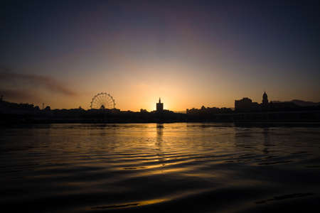 Malaga harbor CityPanorama with sunsetの写真素材
