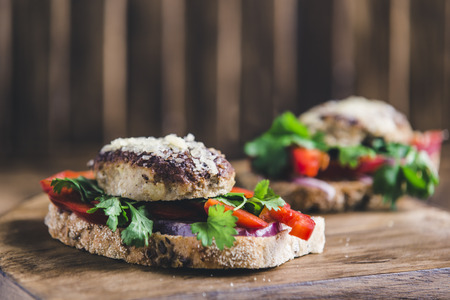sandwich with cutlet, peppers onions and cheese