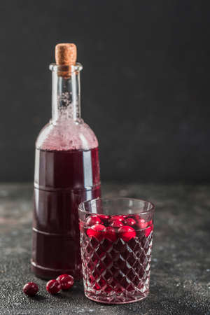 The concept of a summer refreshing drink from red berries: berry Morse of fresh strawberries and...