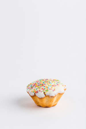 Muffin with chocolate icing and jam on a white background, isolated. Close-up with a copy space for the text.の写真素材
