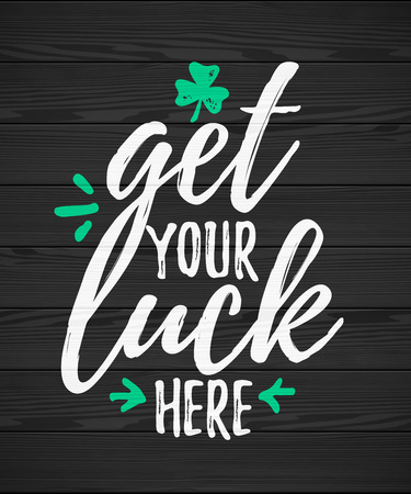 Get Your Luck Here funny handdrawn dry brush style lettering on black wooden background, 17 March St. Patrick's Day celebration. Suitable for t-shirt, poster, etc.のイラスト素材