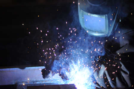 electric welder brews steel at the factory