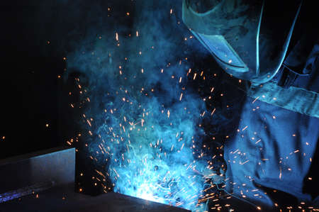 electric welder brews steel at the factory