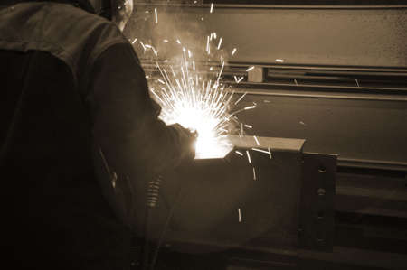 Welding in a car factory with sparks.の写真素材