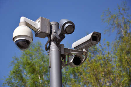 closed circuit camera Multi-angle CCTV system against the blue sky, installed on a city street