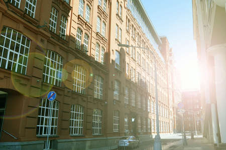 Apartment building on the street flooded with sunlight, Moscow, Russia. Summer