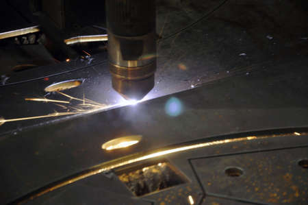 laser cutting torch machine in an industrial plant cuts sheet metal. Industry