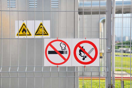 Factory. Sign Flammable on the fence of an industrial facilityの写真素材