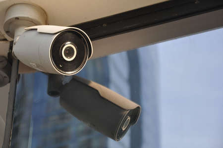 Closed circuit camera Multi-angle CCTV system against the blue sky, installed on a city street