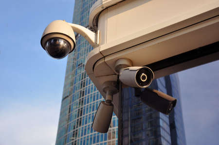 Closed circuit camera Multi-angle CCTV system against the blue sky, installed on a city street