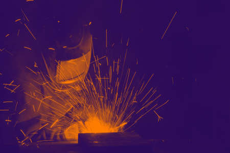 electric welder brews steel at the factory. industrialの写真素材