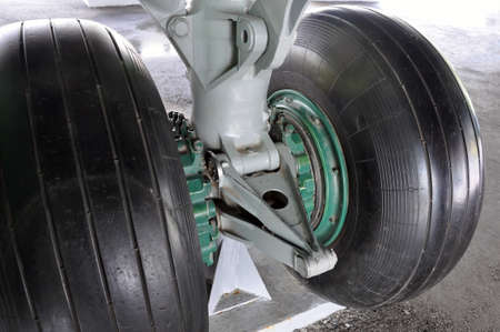 The chassis of the aircraft in the process of parking on the runway.