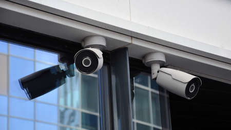 closed circuit camera Multi-angle CCTV system against the blue sky, installed on a city street. Security.の写真素材