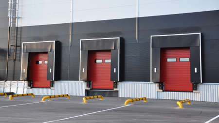 Empty loading dock of a large warehouse. Modern warehouse complex. Industry and transportの写真素材