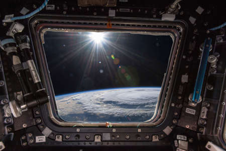 Typhoon over planet Earth - satellite image from the spacecraft. Sun raysの写真素材