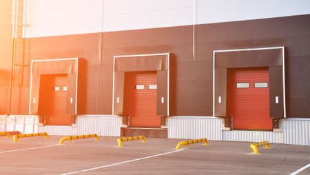 Empty loading dock of a large warehouse. Modern warehouse complex. Industry and transport